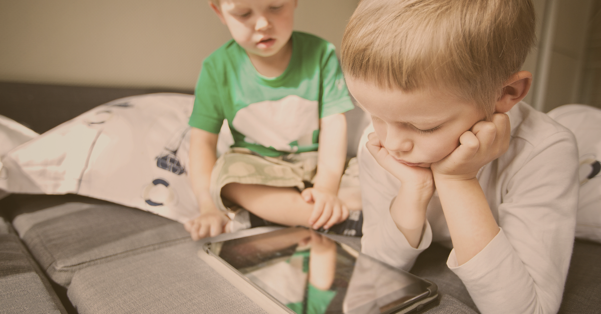 Father setting screen time limits for children with balance and routine